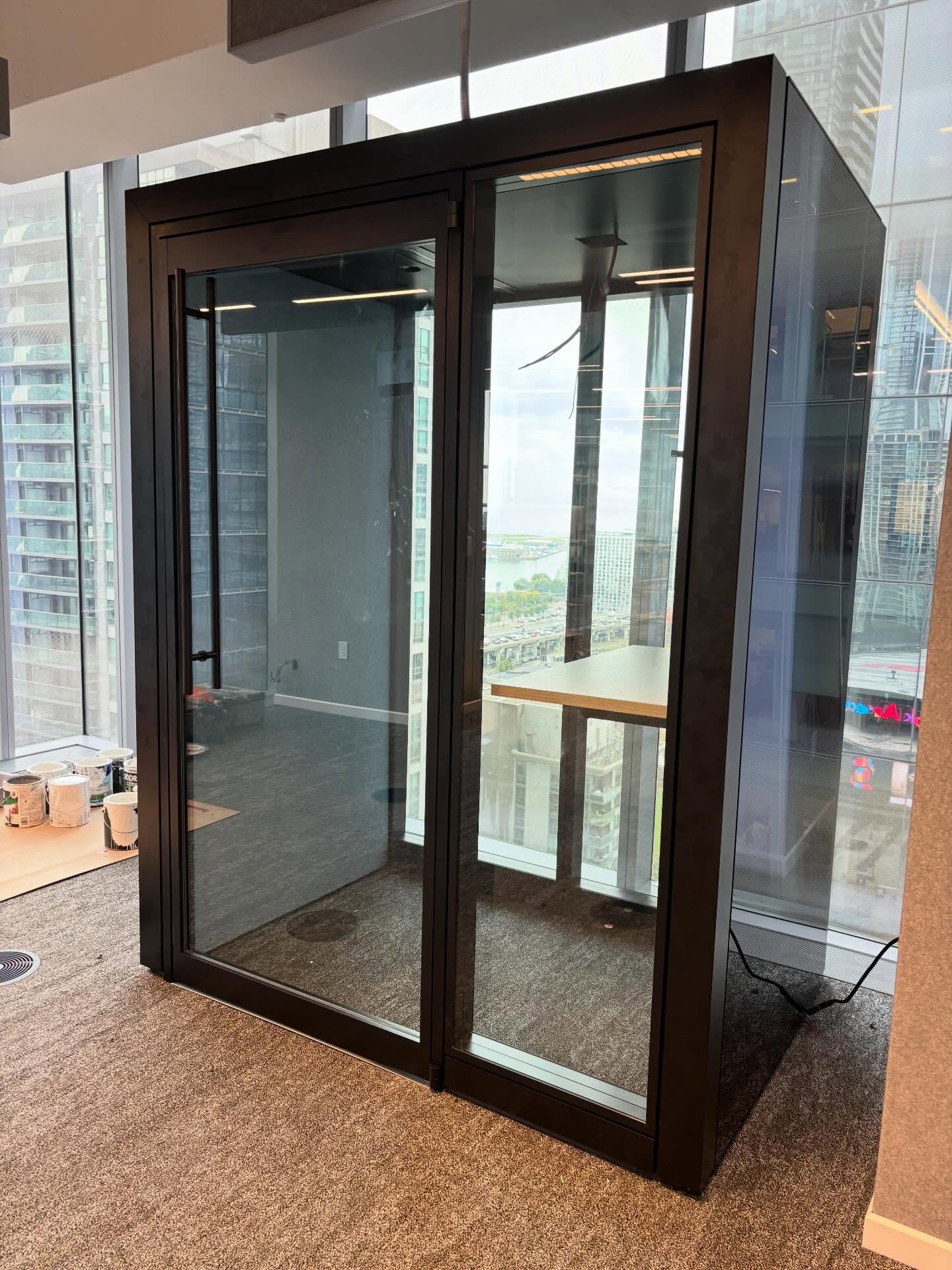 Enclosed focus pod near office windows